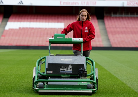 female groundsman staff mow stadium sml